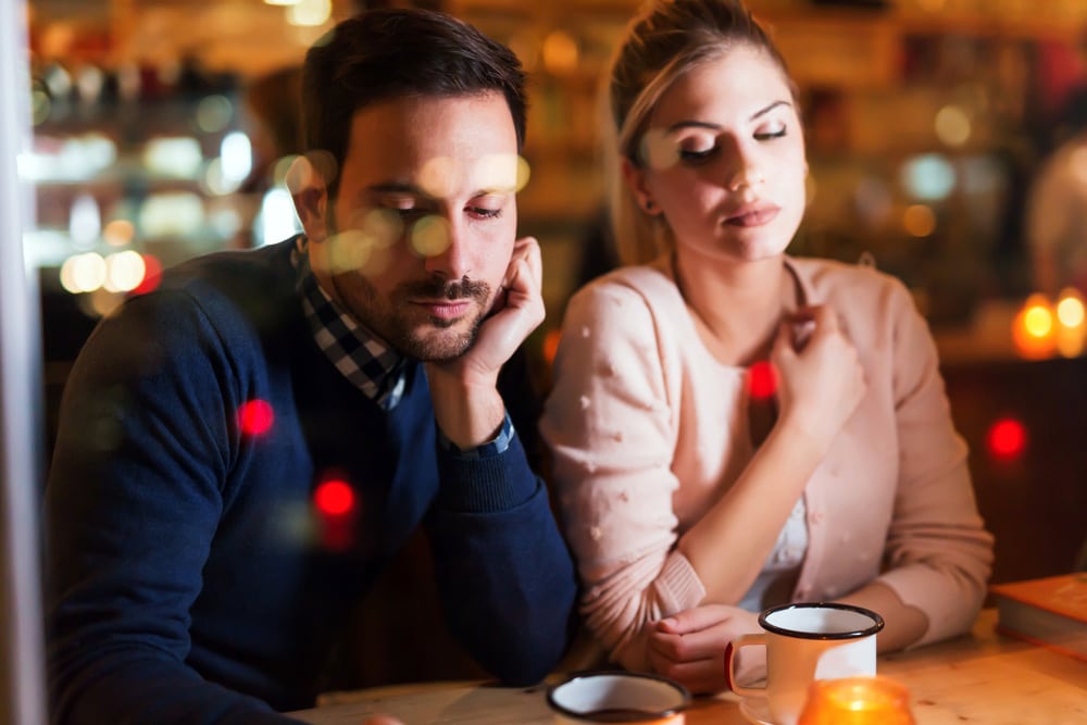 Bored couple in restaurant