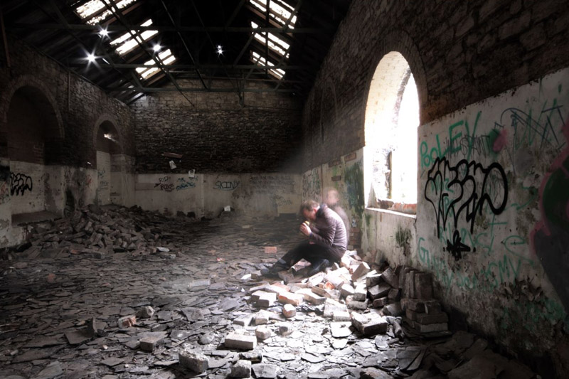 Man alone in a room with debris